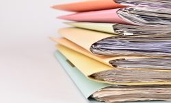 colorful paperwork Stacked files on isolated background